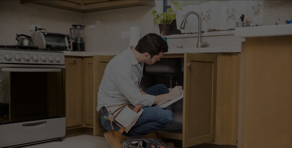 Home service pro inspecting a kitchen